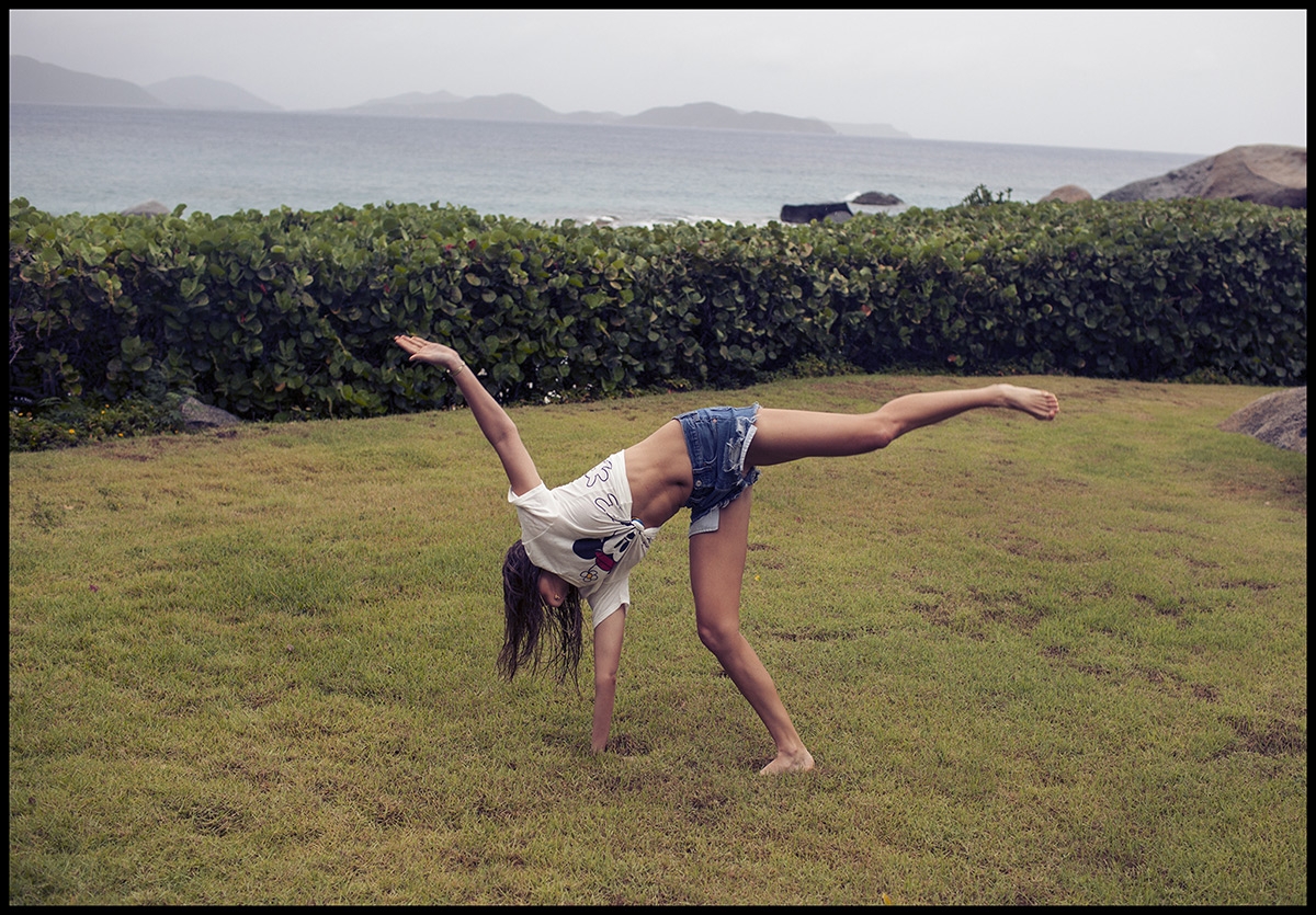 Our model doing cartwheels on a lawn that overlooks the ocean and surrounding mountains 