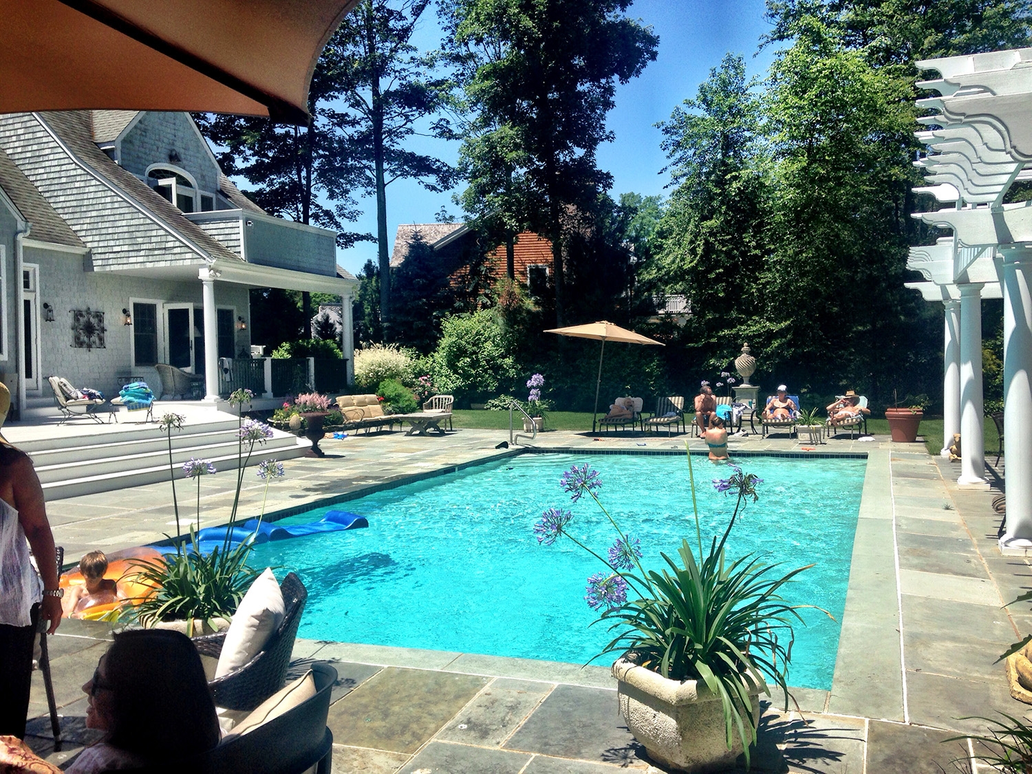 The large pool on a sunny day at a house in East Hampton 